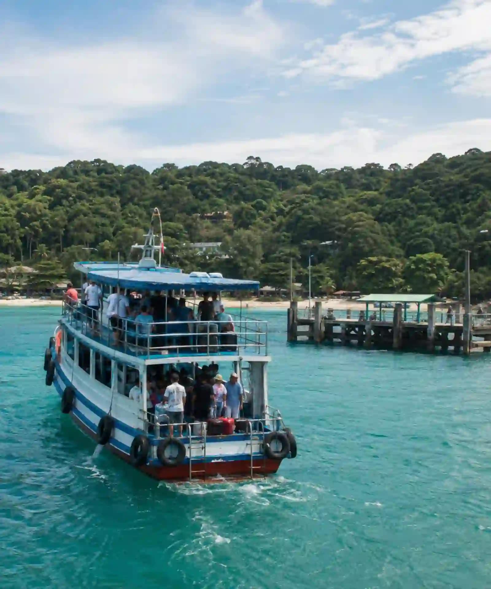 Koh Samet Sun, Sand, and Samet: What You Need to Know Before You Go 4 A local passenger ferry approaching a Koh Samet pier with travellers and luggage aboard