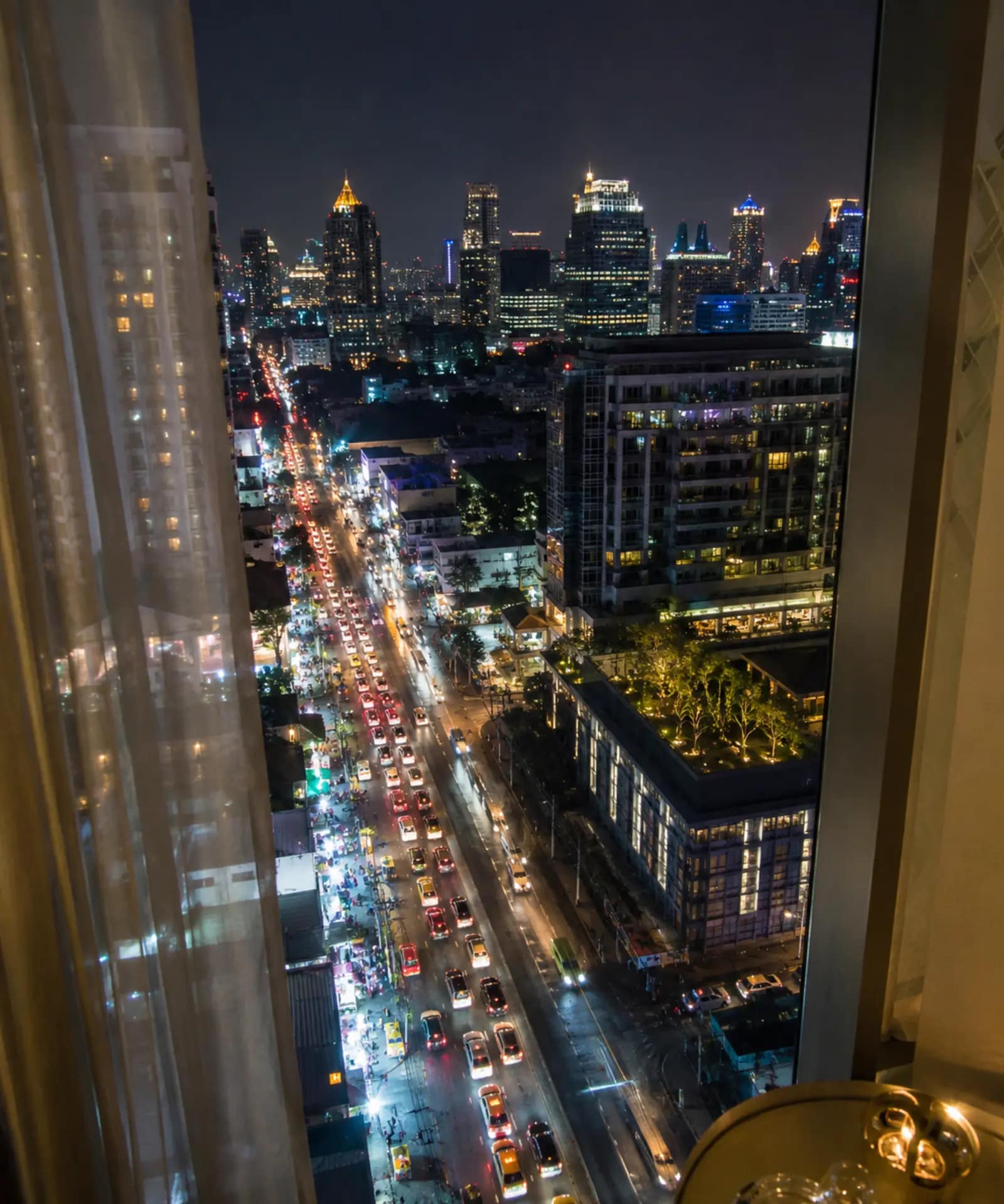 NH Bangkok Sukhumvit Boulevard Review: Is It Worth the Stay? 13 Busy Bangkok nightlife and traffic seen from a hotel window