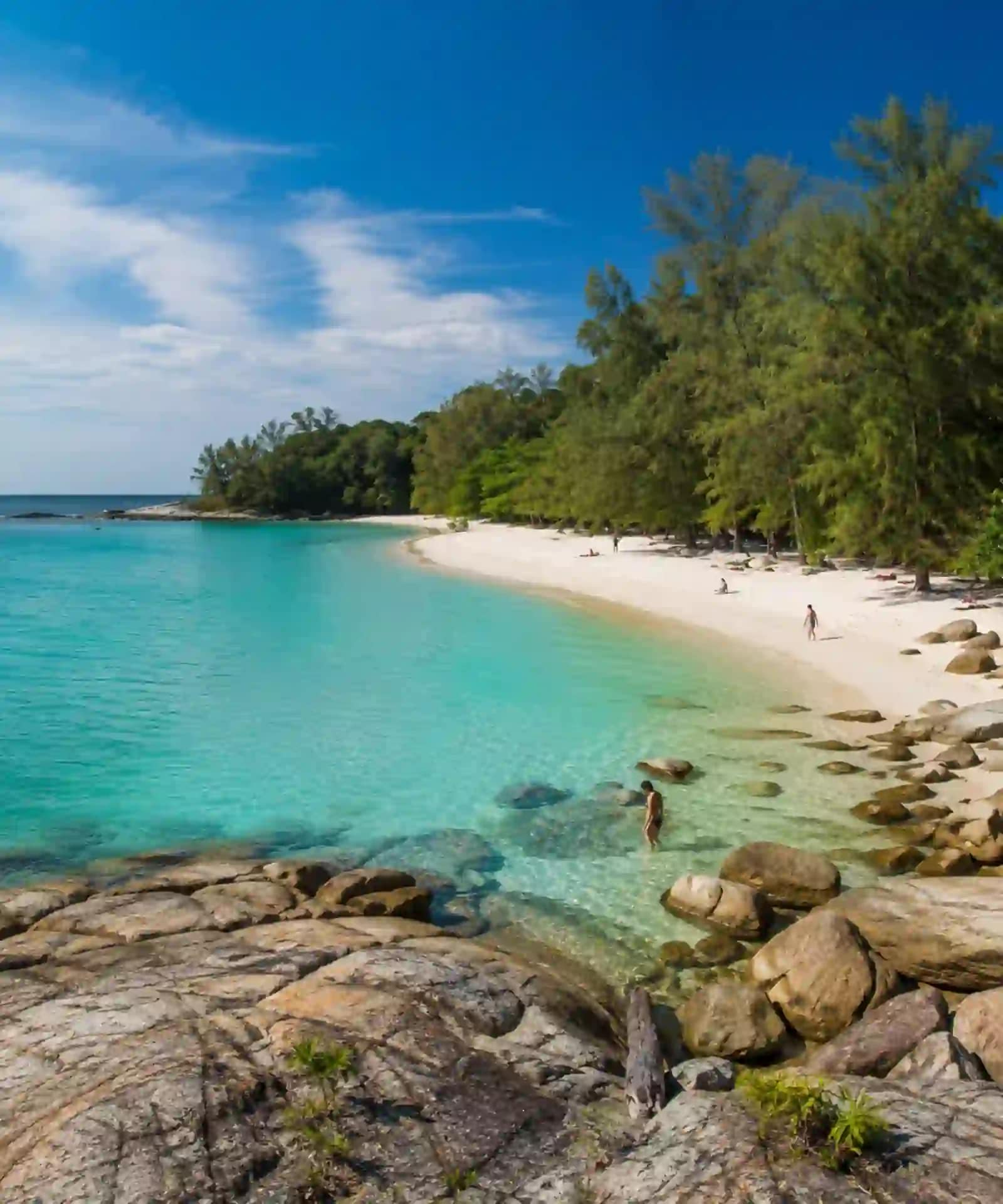 Koh Samet Sun, Sand, and Samet: What You Need to Know Before You Go 7 A clear turquoise bay with pale sand, rocks and casuarina trees on Koh Samet